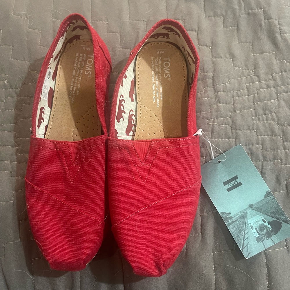 Brand new red Toms canvas shoes with tags - size 8 - perfect condition :)